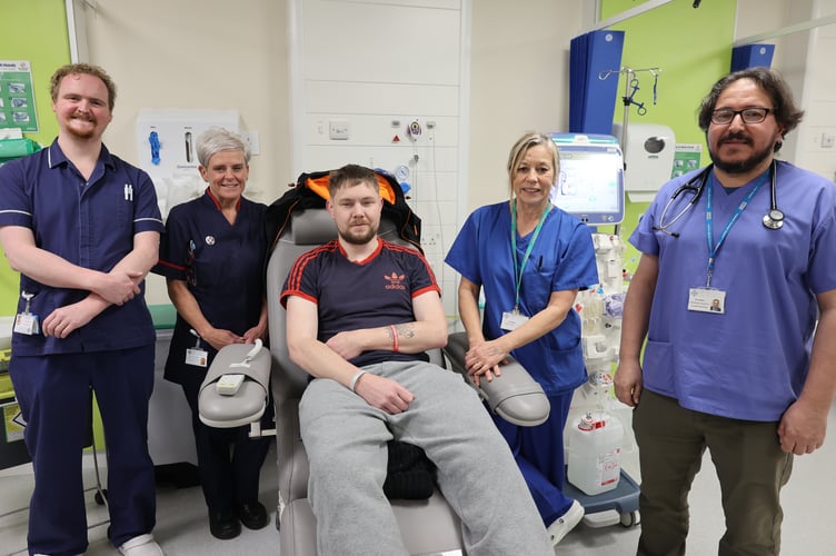 Mike Newton receiving his dialysis at Ysbyty Gwynedd with members of the Renal Team