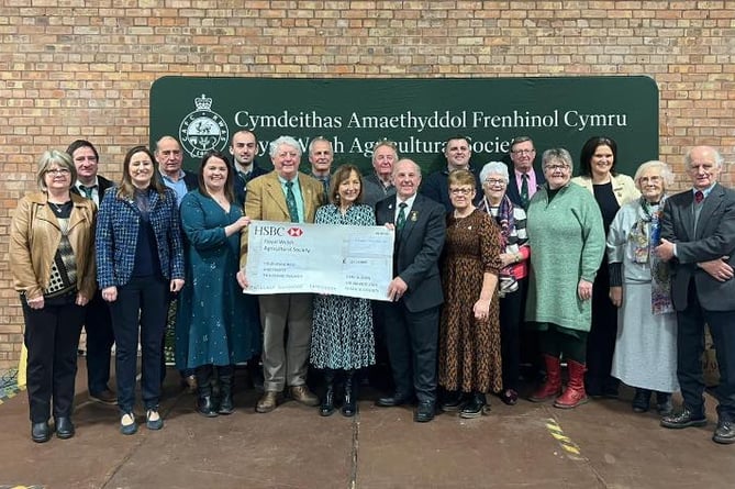 RWAS Feature County 2024 President, Mr Denley Jenkins and Ambassador, Mrs Esyllt Ellis Griffiths, along with the Ceredigion Committee members presenting the cheque for £430,000 to RWAS Chair of Board, Prof. Wynne Jones and Chair of Council, Mrs Nicola Davies at the recent RWAS Council Meeting.