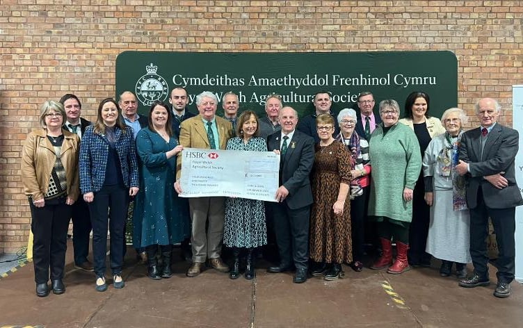 RWAS Feature County 2024 President, Mr Denley Jenkins and Ambassador, Mrs Esyllt Ellis Griffiths, along with the Ceredigion Committee members presenting the cheque for £430,000 to RWAS Chair of Board, Prof. Wynne Jones and Chair of Council, Mrs Nicola Davies at the recent RWAS Council Meeting.