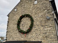 Pontrhydfendigaid woman decorates side of house with 12ft wreath