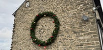 Pontrhydfendigaid woman decorates side of house with 12ft wreath