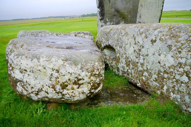 The Altar Stone, seen here underneath two bigger Sarsen stones