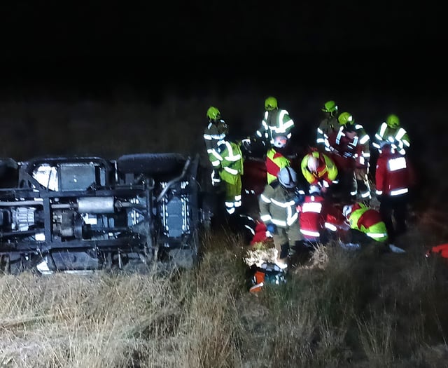 Four rescued from overturned car near reservoir edge