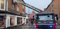 Firefighters remove dangerous window in town centre