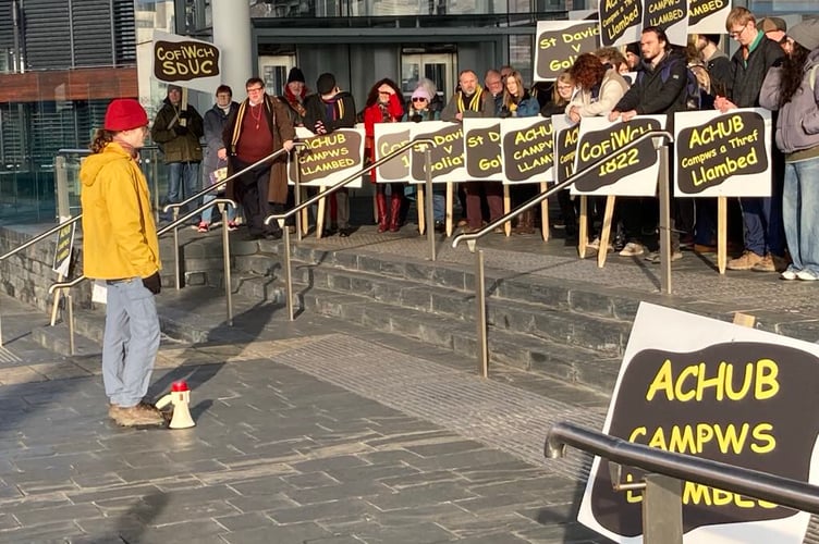 Lampeter student Jaime Fitter addresses campaigners outside the Senedd