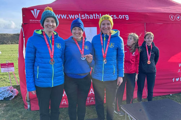 Lainy Heckley, Theresa Sharland and Lina Land celebrating their podium place