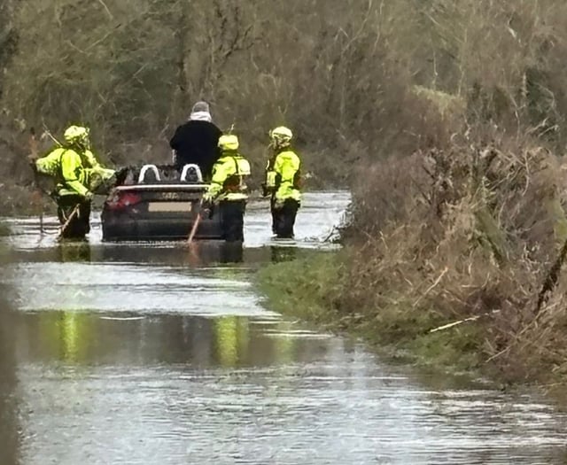 Fire crews rescue motorist from flood waters