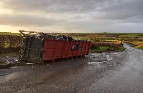 The container was abandoned in a lay-by on the C2704 road leading to Llansaint on or before Monday, January 27, 2025.