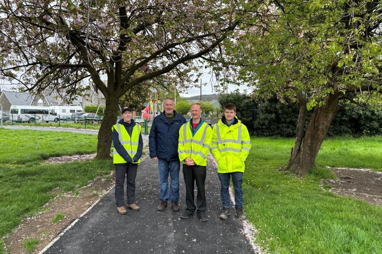 Local member, Cllr Dilwyn Morgan on the improved paths, with Gwynedd Council staff. Photo: Gwynedd Council