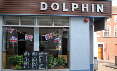 Facing the new Town Clock was the Dolphin Fish Restaurant, a popular fish and chip shop and an Aberystwyth
institution for many years, photographed here in 2011 at the time of the royal wedding