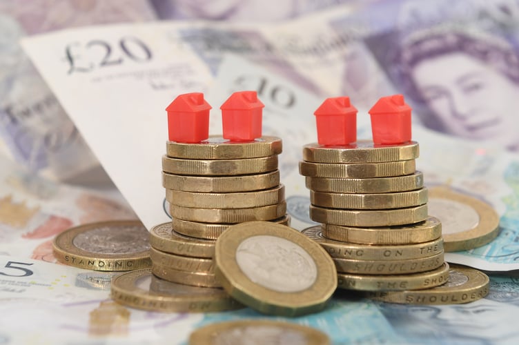 File photo dated 12/09/18 of model houses on a pile of coins and bank notes. More than a third of students in Scotland are struggling to pay their rent, a poll commissioned by the National Union of Students (NUS) reported. Nine out of every 10 (91%) of the 34% of respondents who had experienced difficulties paying rent in full, had sought financial support. Issue date: Thursday November 14, 2024.