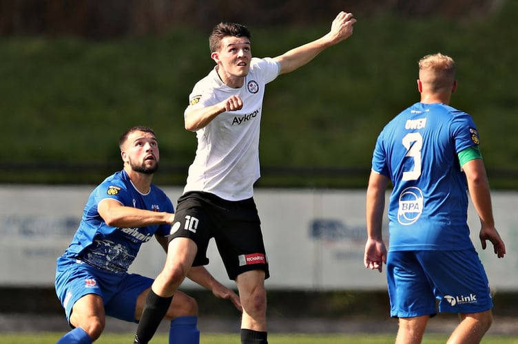 BALA, GWYNEDD, WALES - 31st AUGUST 2024 - Bala's Joe Malkin battles with Penybont's Clayton Green during Bala Town vs Penybont FC in Round 5 of the JD Cymru Premier at Maes Tegid, Bala (Pic by Sam Eaden/FAW)